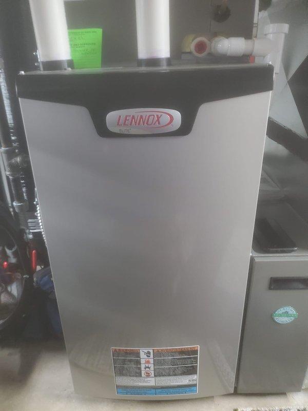 Performed scheduled maintenance on Lennox Elite furnace system. Inspected interior components including blower motor assembly, circuit board, and all electrical connections. Verified proper operation and condition of all system components with no issues found.