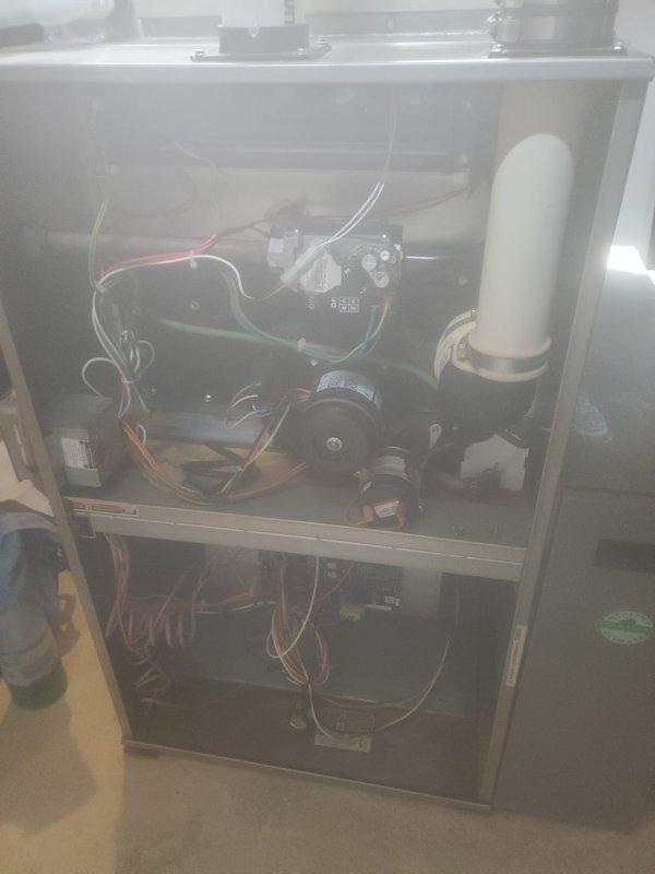 Performed comprehensive maintenance on 10-year-old furnace located in basement. Inspected internal components including control board, blower motor, wiring connections, and PVC exhaust/drain system. Examined copper pipe fittings and associated plumbing connections to ensure proper operation through heating season.