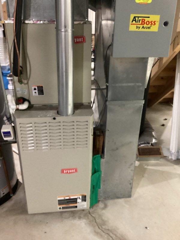 Completed comprehensive estimate for replacement of existing HVAC system, including Bryant furnace unit with connected ventilation and AirBoss by Arzel zoning system. Assessment included documentation of current installation in basement utility area, with particular attention to ductwork configuration and control unit placement for proper system integration.