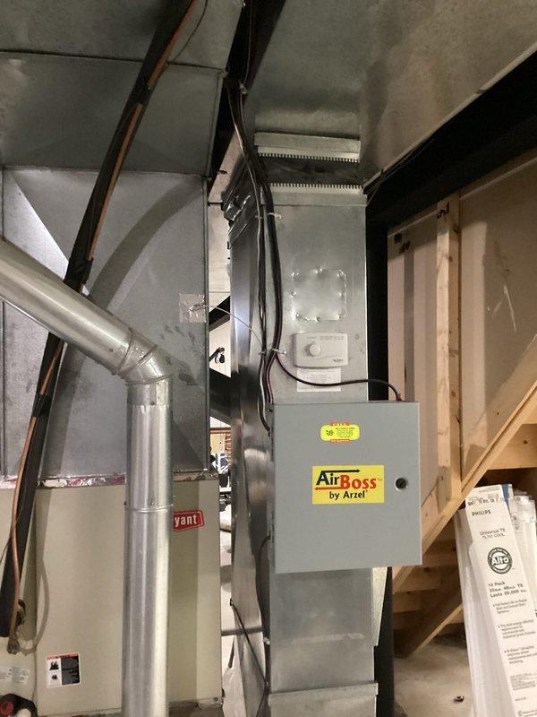 Completed comprehensive estimate for replacement of existing HVAC system, including Bryant furnace unit with connected ventilation and AirBoss by Arzel zoning system. Assessment included documentation of current installation in basement utility area, with particular attention to ductwork configuration and control unit placement for proper system integration.