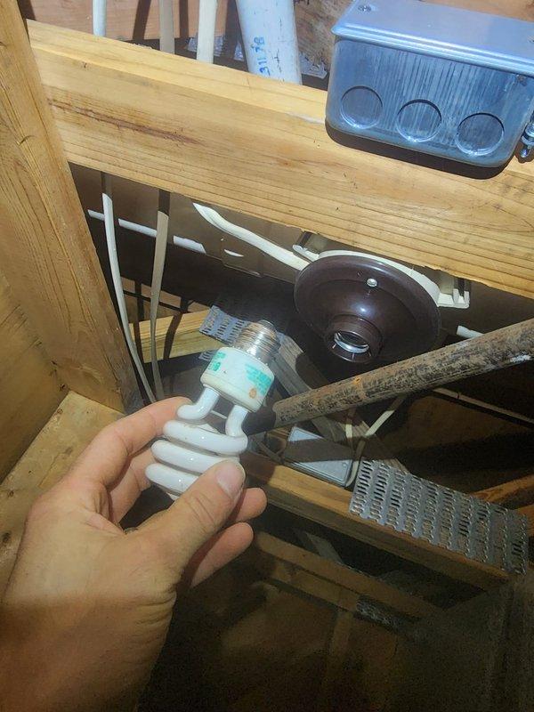 Responded to callback regarding increased noise concerns after previous repair. Inspected attic/crawlspace mechanical infrastructure, including ductwork, electrical components, and mounting hardware. Identified loose CFL fixture near fan assembly as source of vibration noise; secured fixture and verified normal system operation with significantly reduced noise levels.