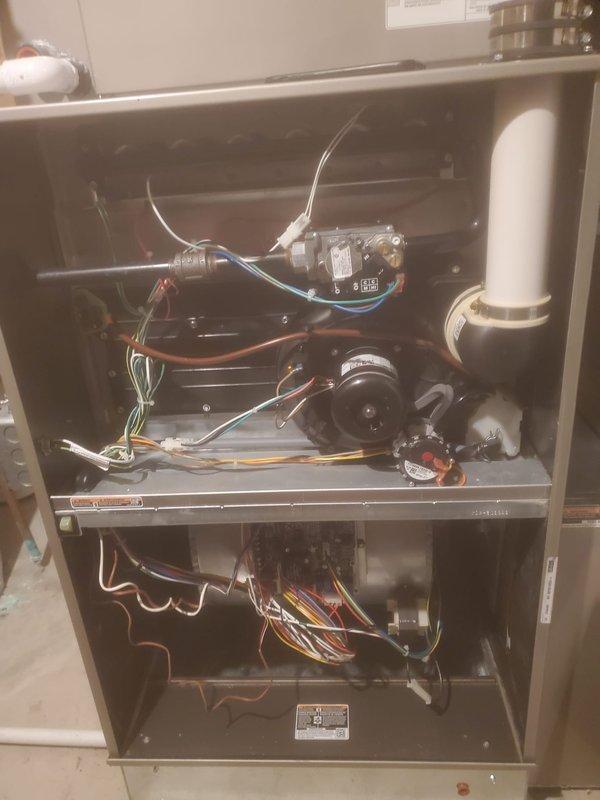 Performed comprehensive tune-up on 4-year-old Bryant furnace located in basement. Inspected internal components including control board, wiring connections, and ventilation system with particular attention to the PVC exhaust pipes. System is functioning properly with all components in good condition; no issues detected during maintenance service.