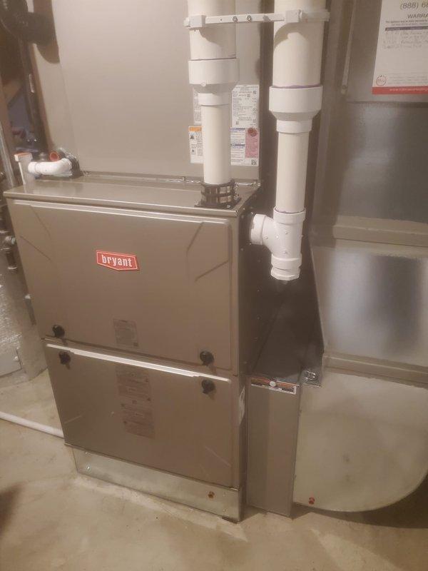 Performed comprehensive tune-up on 4-year-old Bryant furnace located in basement. Inspected internal components including control board, wiring connections, and ventilation system with particular attention to the PVC exhaust pipes. System is functioning properly with all components in good condition; no issues detected during maintenance service.