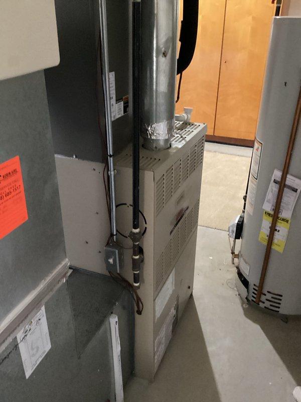 Completed thorough inspection of existing HVAC system in utility room, including gas furnace with vertical flue pipe and connected water heater. Documented current installation configuration, noting ductwork connections, condensate drainage system with PVC piping, and electrical components for replacement estimate. Prepared comprehensive quote (CQ #03871-04) for complete HVAC system replacement with upgraded equipment.