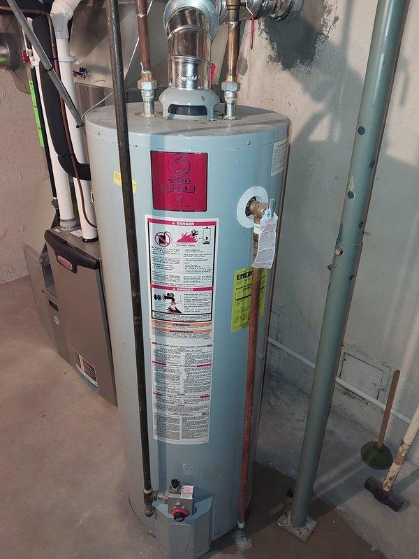Performed scheduled furnace maintenance per the prepaid maintenance agreement. Inspected water heater installation and associated plumbing components including copper piping, valves, and ventilation system. All connections appear properly installed with no visible leaks or safety concerns noted.