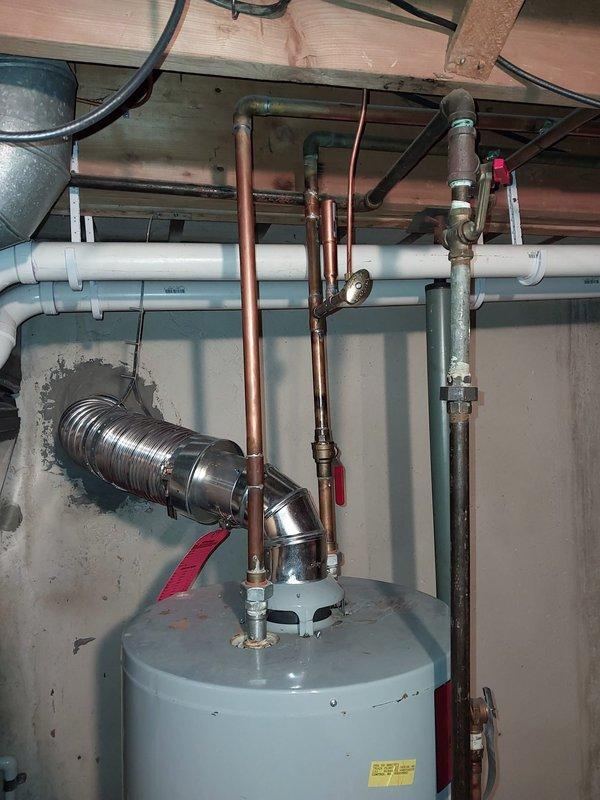 Performed scheduled furnace maintenance per the prepaid maintenance agreement. Inspected water heater installation and associated plumbing components including copper piping, valves, and ventilation system. All connections appear properly installed with no visible leaks or safety concerns noted.