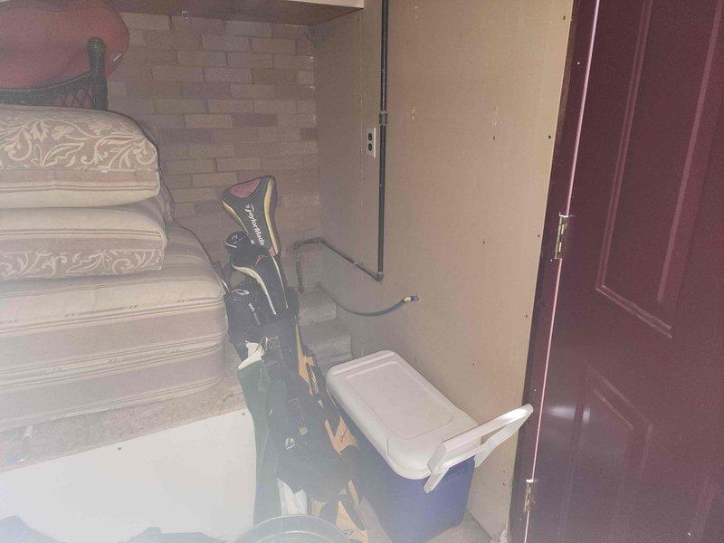 # Electrical Estimate - Generator Service Summary

Conducted on-site evaluation and documentation for generator transfer switch installation. Assessed existing electrical infrastructure and confirmed specifications for EST10-12pLVM transfer switch unit mounted on exterior wall near residential entry point. Photographed installation location, including interior access points and exterior mounting position of transfer switch equipment, to provide comprehensive visual documentation for project estimate and planning purposes.