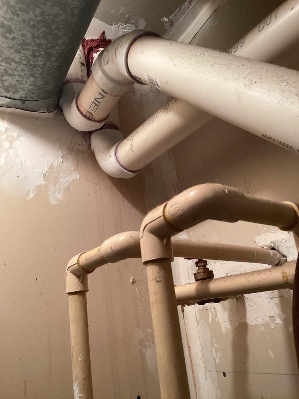 # HVAC Estimate - Replacement Summary

Conducted comprehensive site assessment for furnace and HVAC system replacement at residential property. Evaluated existing utility room configuration including aged water heater, deteriorating plumbing infrastructure, and current heating system setup. Documented existing conditions showing multiple pipe runs (PVC and copper), floor drain access points, and available clearances for equipment installation. Assessed wall conditions, utility connections, and spatial constraints to determine optimal equipment placement and required modifications for new furnace installation. Provided detailed replacement estimate covering equipment specifications, installation requirements, and necessary upgrades to meet current code standards for safe and efficient operation.