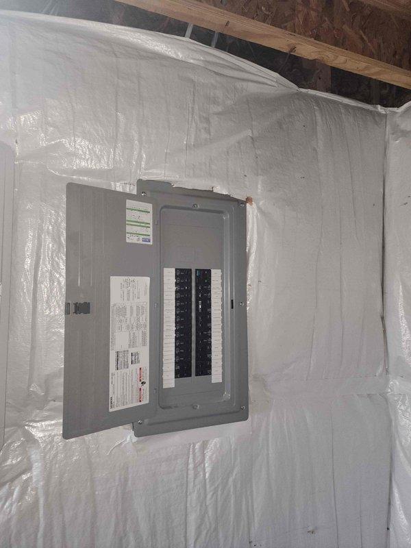 Conducted electrical assessment for electric vehicle charging station installation at residential property. Evaluated existing electrical panel capacity and circuit availability to determine feasibility of adding dedicated 240V circuit for Level 2 EV charger. Panel inspection revealed standard residential breaker configuration with labeled circuits serving various household loads including range, HVAC, kitchen appliances, and bedroom receptacles. Assessed available breaker spaces and current electrical load to ensure adequate capacity for EV charging equipment installation. Documented panel location in unfinished utility area with proper access for future installation work. Provided customer with technical evaluation and installation requirements for proceeding with EV charger project.