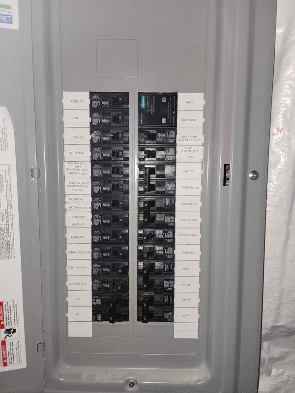 Conducted electrical assessment for electric vehicle charging station installation at residential property. Evaluated existing electrical panel capacity and circuit availability to determine feasibility of adding dedicated 240V circuit for Level 2 EV charger. Panel inspection revealed standard residential breaker configuration with labeled circuits serving various household loads including range, HVAC, kitchen appliances, and bedroom receptacles. Assessed available breaker spaces and current electrical load to ensure adequate capacity for EV charging equipment installation. Documented panel location in unfinished utility area with proper access for future installation work. Provided customer with technical evaluation and installation requirements for proceeding with EV charger project.