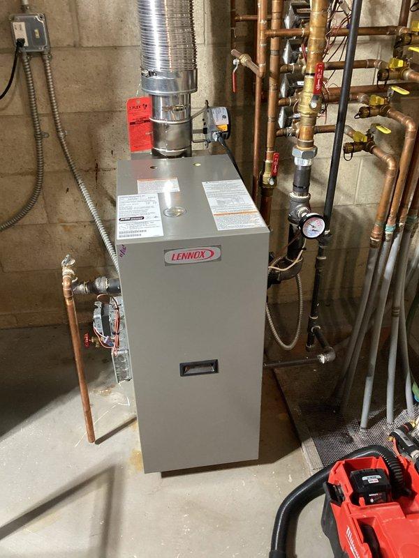 Performed comprehensive preventive maintenance on Lennox residential boiler system. Conducted thorough inspection of all internal components including blower motor, heat exchanger, control board, and electrical connections. Verified proper operation of hydronic piping system, checked pressure gauges, and inspected all brass valves and fittings for leaks or wear. Cleaned and tested burner assembly, examined copper tubing connections, and confirmed all safety controls functioning within manufacturer specifications. System tested and operating efficiently upon completion.