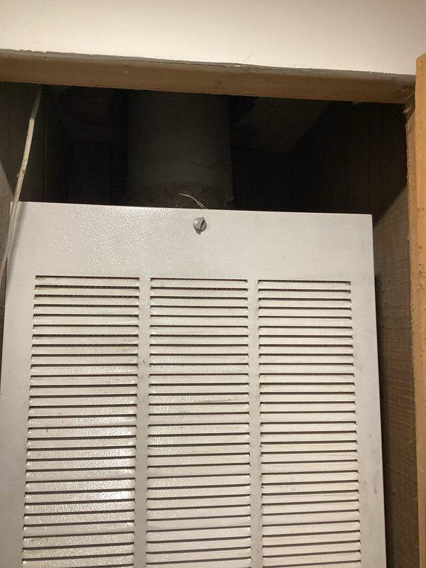 Completed on-site evaluation for HVAC system replacement estimate. Documented existing outdoor condensing unit showing significant age-related deterioration and weathering, currently installed without proper concrete pad placement. Assessed indoor air handler with grille-style return air access point. Photographed equipment conditions and installation configurations to support comprehensive replacement proposal for complete system upgrade.
