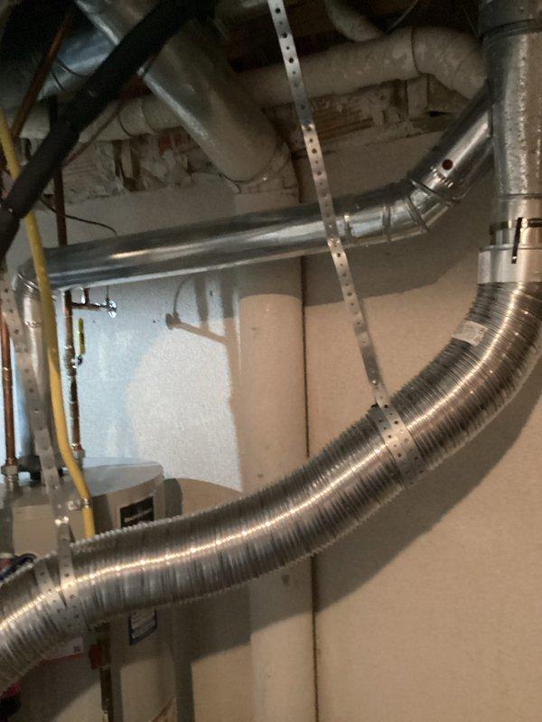 Completed estimate for water heater replacement due to active leak. Documented existing installation including gas line connections, copper water piping with shutoff valves, and venting configuration with metallic ductwork in basement utility space.
