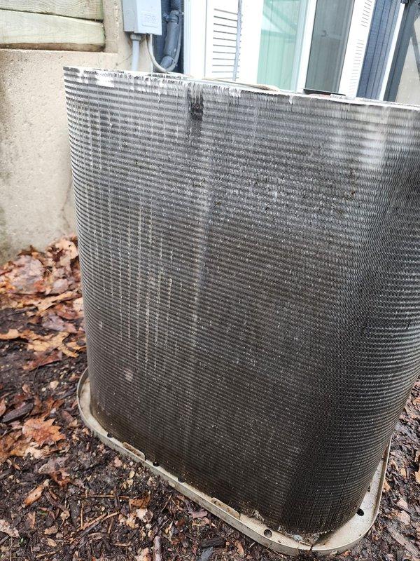 Completed comprehensive furnace and air conditioning maintenance inspection on residential HVAC system. Performed thorough examination of outdoor condenser unit, noting moderate weathering and dirt accumulation on exterior fins and coil surfaces. Inspected internal components including compressor assembly, refrigerant lines, and evaporator coils, observing surface oxidation and corrosion consistent with normal outdoor exposure. Documented equipment condition through photographic records showing operational components and overall system status. System enrolled in new preventative maintenance plan to ensure continued performance and longevity.