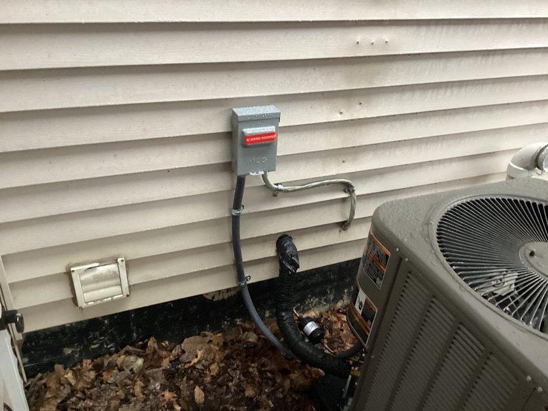 Completed full installation of Lennox air conditioning system with outdoor condenser unit and Ecobee6 smart thermostat. Installed electrical disconnect box with proper conduit routing to outdoor unit, mounted condenser on exterior pad with appropriate clearances, and completed all refrigerant line connections and electrical hookups. System tested and verified operational with proper airflow and temperature differential.