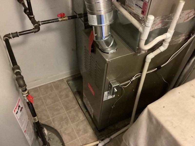 Installed new Bryant 80% efficiency furnace in residential basement utility room. Reused existing safety pan and installed new wet switch per sales specifications, ensuring proper drainage protection and system safety compliance. All gas connections, PVC condensate lines, and flexible ductwork were properly configured and secured, with system tested and verified operational.