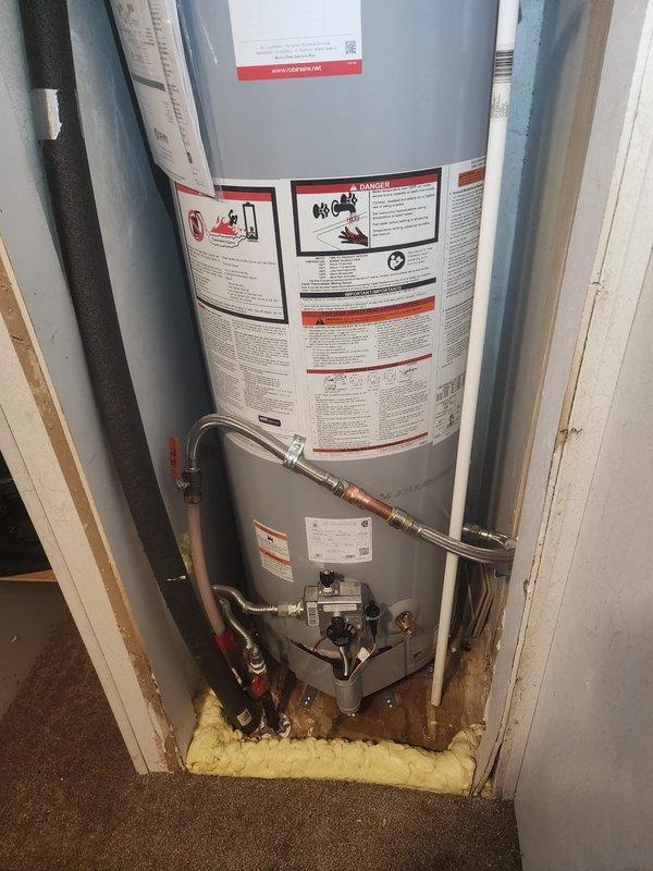 Completed installation of State ProLine Commercial Grade tanked water heater in mobile home utility closet. Removed existing unit and installed replacement water heater with proper clearances in confined space. Connected cold water inlet and hot water outlet lines using flexible copper connectors and installed appropriate shut-off valves for isolation capability. Installed temperature and pressure relief valve at top of unit with discharge piping. Connected vent pipe system at top of heater to ensure proper exhaust ventilation. Secured all plumbing connections and tested for leaks. Verified proper operation of unit and all safety components upon completion.