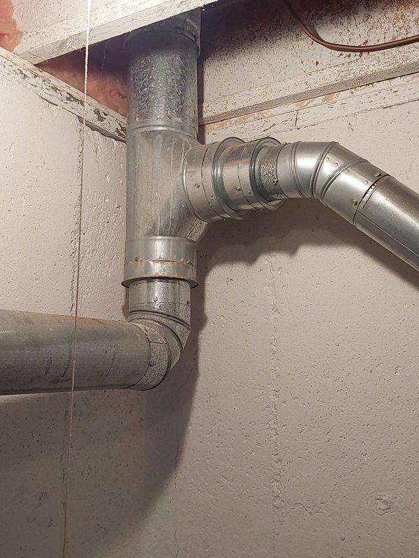 Responded to emergency call for no hot water and active water heater leak in basement affecting entire household. Upon arrival, inspected 20-year-old tanked water heater and identified catastrophic failure with active leaking at tank base, indicating internal tank corrosion and structural compromise. Given the age of the unit and severity of the leak, recommended immediate replacement rather than repair. Shut off water supply and drained existing failed unit to prevent further water damage to basement area. Disconnected all water supply lines, temperature and pressure relief valve discharge piping, and gas connections following proper safety protocols. Removed old water heater from service location in basement utility area. Installed new tanked water heater with proper clearances per manufacturer specifications and local code requirements. Connected cold water supply line with new shut-off valve, installed new flexible gas connector with proper sizing, and attached hot water distributi