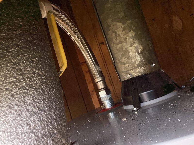 Completed installation of tanked water heater in outdoor utility closet enclosure. Installed new water heater unit with proper plumbing connections, including copper supply lines, brass fittings, and shut-off valves. Connected black piping and flexible hoses to equipment, ensuring all connections were secure and code-compliant. System tested and verified operational upon completion.