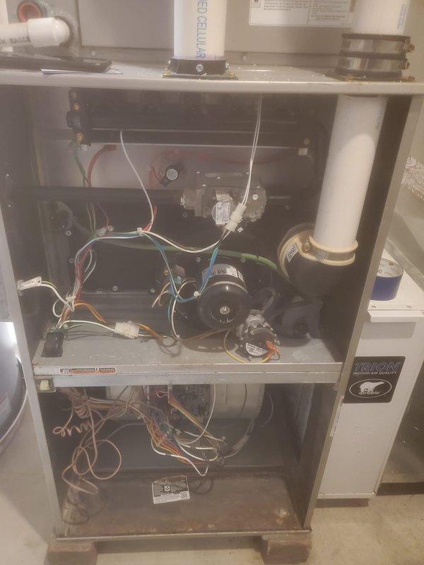 Performed annual maintenance and tune-up on 6-year-old furnace system located in basement. Completed comprehensive inspection of all mechanical and electrical components including blower motor assembly, gas valve, pressure switches, and control modules. Observed significant mineral buildup and white crystalline deposits on condensate drain line components and PVC piping, indicating potential drainage concerns that will require monitoring. All safety controls tested and verified operational, wiring connections inspected and confirmed secure, and unit returned to normal service.