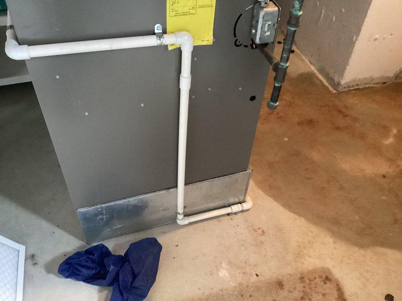 Completed installation of 50-gallon tanked water heater in residential utility space. Connected supply and discharge plumbing lines with proper fittings, installed temperature and pressure relief valve with discharge piping, and verified all connections for proper operation and absence of leaks.