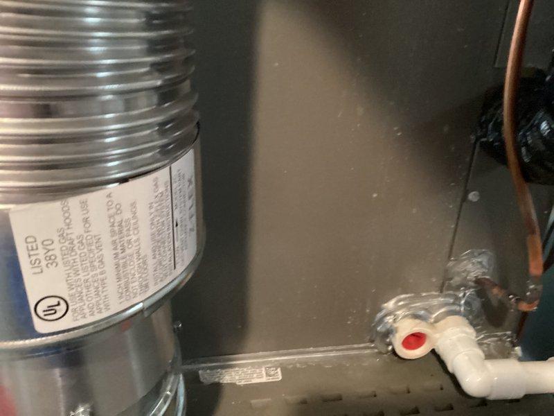 Completed installation of 50-gallon tanked water heater in residential utility space. Connected supply and discharge plumbing lines with proper fittings, installed temperature and pressure relief valve with discharge piping, and verified all connections for proper operation and absence of leaks.