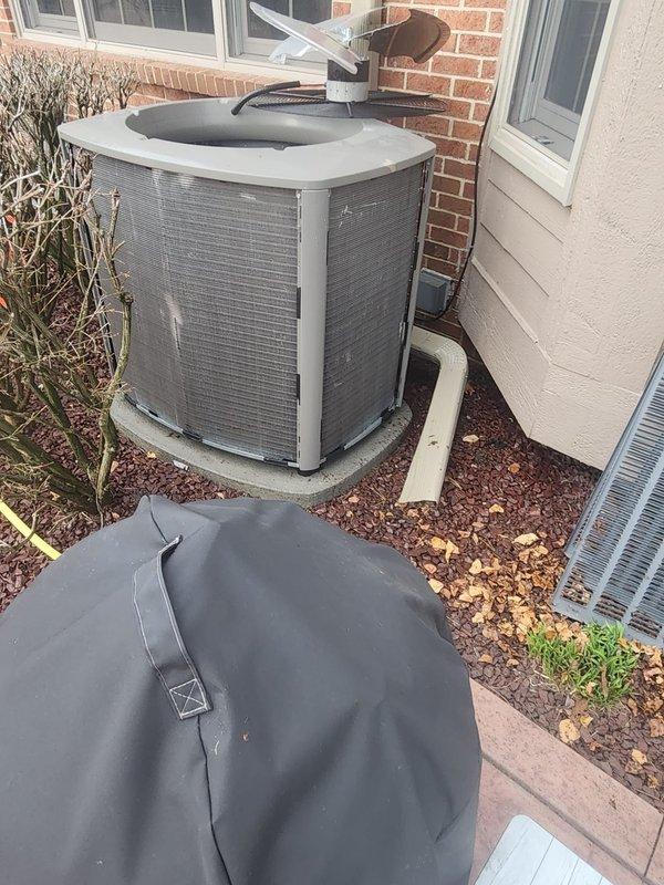 Completed scheduled preventive maintenance on residential air conditioning system. Performed comprehensive inspection of outdoor condensing unit, including examination of compressor assembly, refrigerant lines, electrical connections, and condenser coil. Unit found operating within normal parameters with copper refrigerant lines and connections in good condition, though moisture residue observed on internal mounting plate indicating normal condensation during operation.