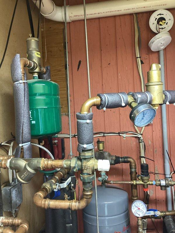Completed comprehensive boiler maintenance service including full system inspection of hydronic heating components. Verified proper operation of expansion tank, circulator pump, pressure relief valves, and all associated copper piping connections. Inspected pressure gauges for accurate readings, checked all brass fittings and isolation valves for leaks, and confirmed proper insulation on supply and return lines. System tested and operating within normal parameters with all safety devices functioning correctly.