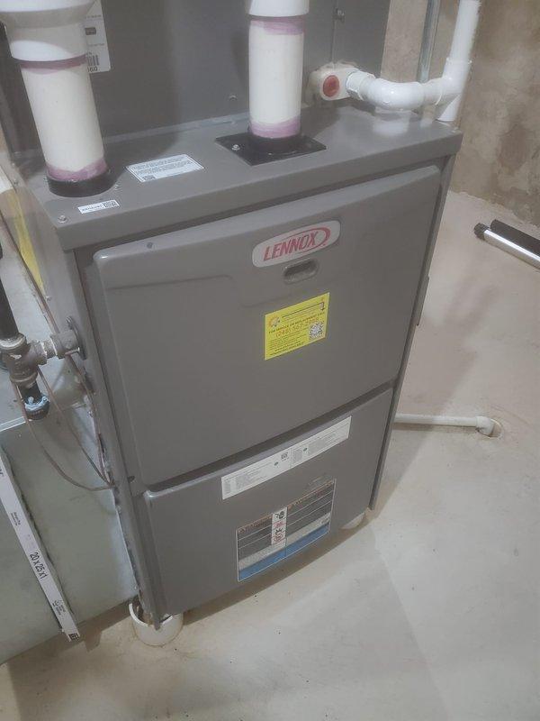 Completed comprehensive furnace maintenance inspection on Lennox forced-air heating system. Performed visual assessment of all internal components including blower assembly, heat exchanger, motor, electrical connections, and ventilation system; noted rust-colored oxidation present on heat exchanger surface requiring monitoring for potential future service needs. All major components remain operational with standard connections intact, and PVC venting system confirmed properly configured.