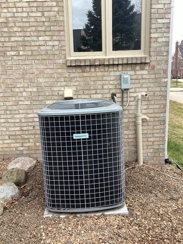 Conducted comprehensive HVAC system evaluation for equipment replacement estimate at residential property. Assessed existing outdoor air conditioning condenser unit with cylindrical design and protective mesh grille, currently positioned on concrete pad with proper clearance and electrical disconnect box installation. Evaluated indoor furnace system located in basement mechanical area, noting current configuration with existing condensate drainage system, PVC piping, and ductwork connections. Provided detailed equipment replacement recommendations featuring Bryant brand HVAC systems per customer preference, documenting current system specifications and proposing appropriate sizing and efficiency ratings for complete heating and cooling system replacement.