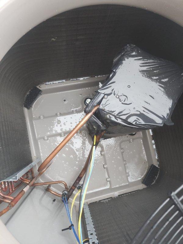 Completed scheduled AC maintenance on residential system. Performed standard inspection of outdoor condenser unit and indoor evaporator coil assembly. Condenser unit exterior grille and fins found in good condition with proper alignment. Indoor evaporator coil showed active condensation with moisture accumulation on coil surface and drain pan, indicating normal system operation. Verified drain pan positioning and inspected refrigerant lines and electrical connections. All components functioning within normal parameters.