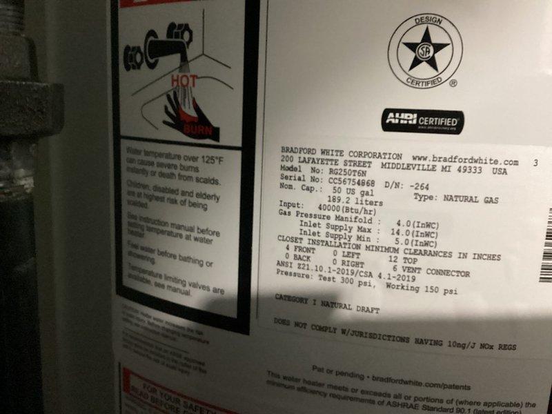 Installed a 50-gallon Bradford White natural gas water heater, model RG2N40H6N, with 40,000 BTU input capacity. Connected all supply and discharge plumbing lines using copper and PVC piping, installed proper venting for Category I natural draft operation, verified gas manifold pressure settings, and positioned drain pan beneath unit for leak protection.