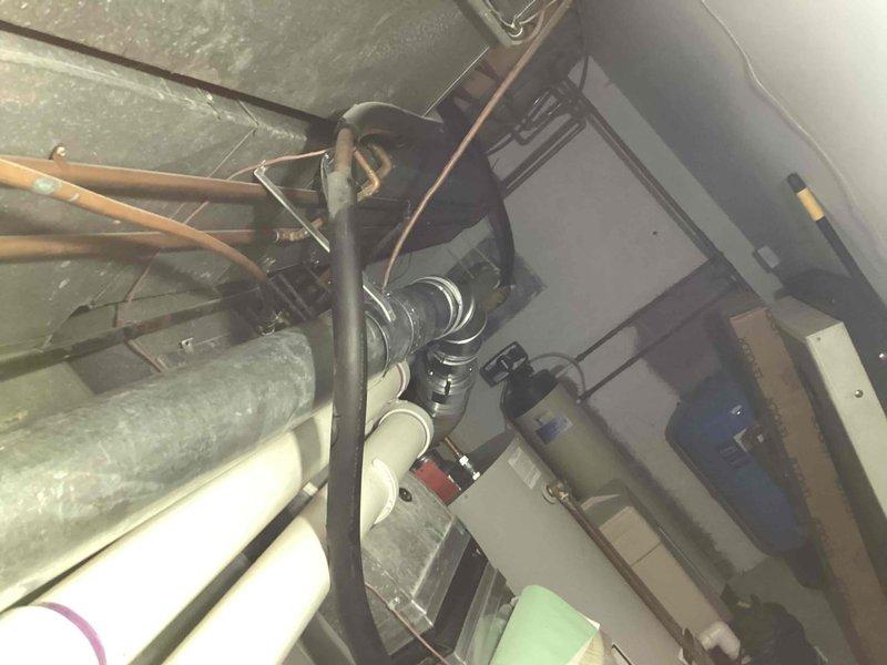 Installed a 50-gallon Bradford White natural gas water heater, model RG2N40H6N, with 40,000 BTU input capacity. Connected all supply and discharge plumbing lines using copper and PVC piping, installed proper venting for Category I natural draft operation, verified gas manifold pressure settings, and positioned drain pan beneath unit for leak protection.