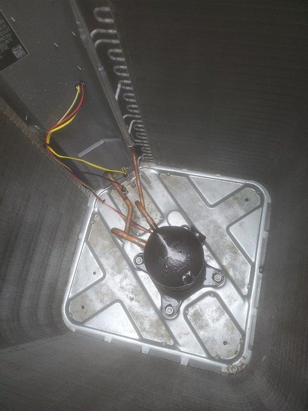 Completed scheduled air conditioning maintenance on residential outdoor condenser unit. Performed comprehensive system inspection including visual assessment of compressor assembly, refrigerant lines, and electrical connections. Inspected copper tubing and capillary lines for proper routing and condition. Verified electrical wiring connections and motor mounting hardware security. Exterior condenser coils showed normal dirt accumulation; unit operational and functioning within normal parameters. All components photographed and documented for service records.