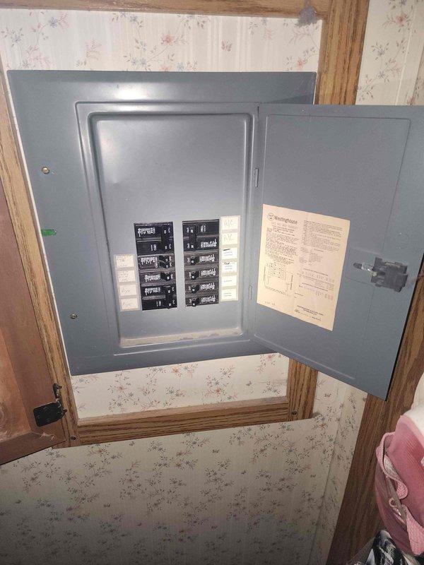 Completed electrical estimate for transfer switch installation. Assessed existing interior main service panel with standard residential circuit breaker configuration and exterior utility disconnect panel showing weathering and rust accumulation. Customer acknowledged estimated timeframe of 3-5 hours with awareness that work may extend beyond initial service window. Documented current electrical infrastructure conditions including panel locations, breaker arrangements, and exterior equipment status to prepare comprehensive installation proposal.