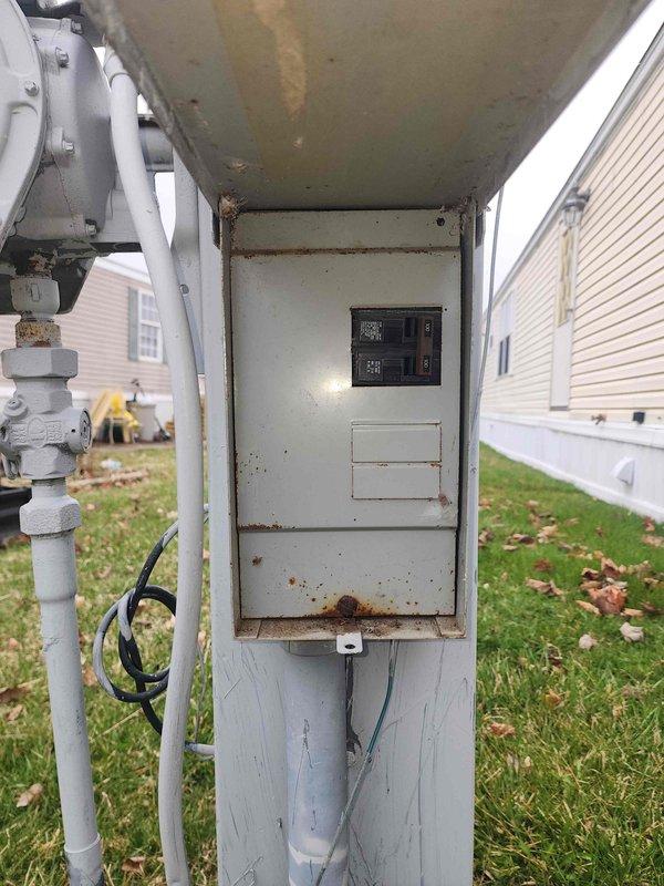 Completed electrical estimate for transfer switch installation. Assessed existing interior main service panel with standard residential circuit breaker configuration and exterior utility disconnect panel showing weathering and rust accumulation. Customer acknowledged estimated timeframe of 3-5 hours with awareness that work may extend beyond initial service window. Documented current electrical infrastructure conditions including panel locations, breaker arrangements, and exterior equipment status to prepare comprehensive installation proposal.