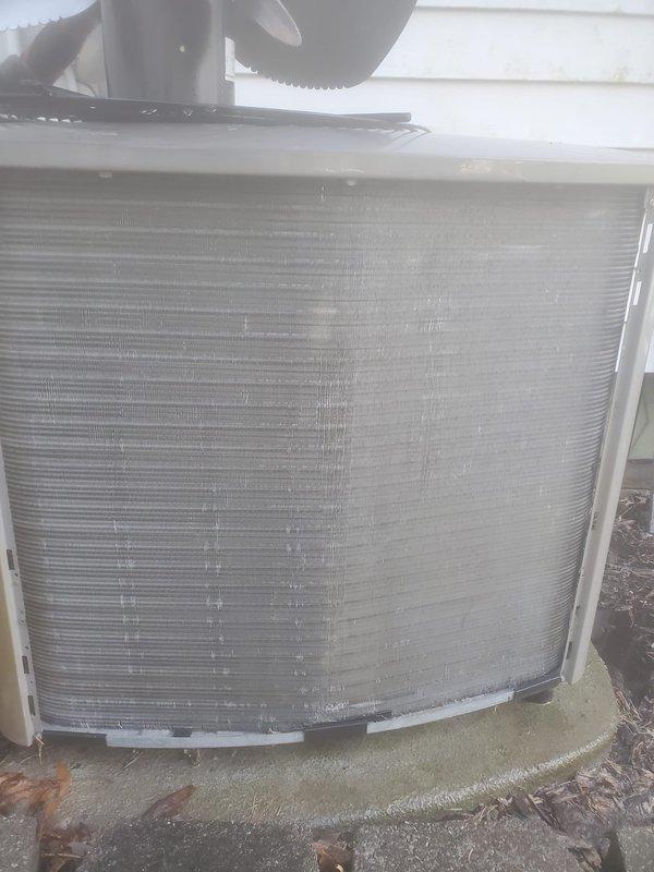 Completed comprehensive cooling system maintenance and tune-up on outdoor condensing unit. Performed full system inspection including compressor operation, refrigerant line connections, electrical components, and condenser coil condition. All components found operating within normal parameters with proper drainage and no refrigerant leaks detected. System confirmed working properly at time of service.