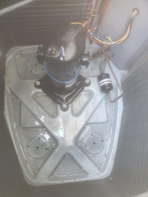 Completed comprehensive cooling system maintenance and tune-up on outdoor condensing unit. Performed full system inspection including compressor operation, refrigerant line connections, electrical components, and condenser coil condition. All components found operating within normal parameters with proper drainage and no refrigerant leaks detected. System confirmed working properly at time of service.