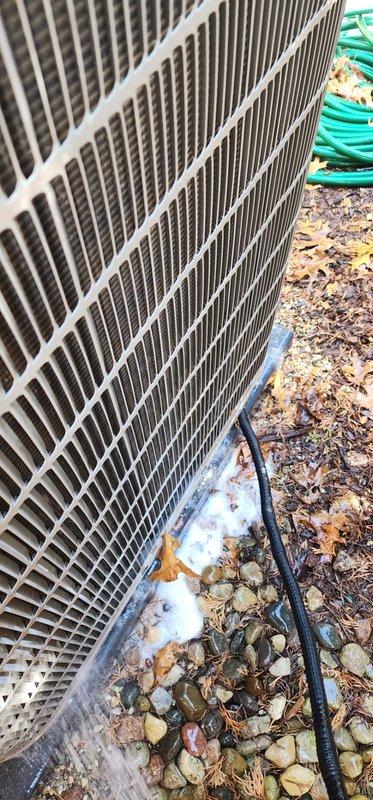 Completed comprehensive AC maintenance service including inspection of indoor evaporator coil and outdoor condensing unit. Inspected drain pan showing normal operational wear and accumulation, verified proper drainage function, and examined copper refrigerant lines for secure connections. Evaluated outdoor condenser unit with attention to coil fins and overall system condition, confirmed unit operational status and proper airflow through heat exchanger components.