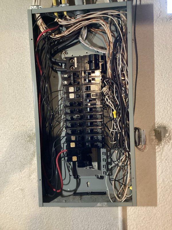 Responded to service call for reported electrical disconnect failure at outdoor AC unit. Upon inspection, found electrical panel with compromised components requiring assessment. Verified AC system integrity, confirmed no damage to air conditioning equipment, and documented electrical panel condition with detailed photographs showing circuit breaker configuration and wiring layout for future reference.