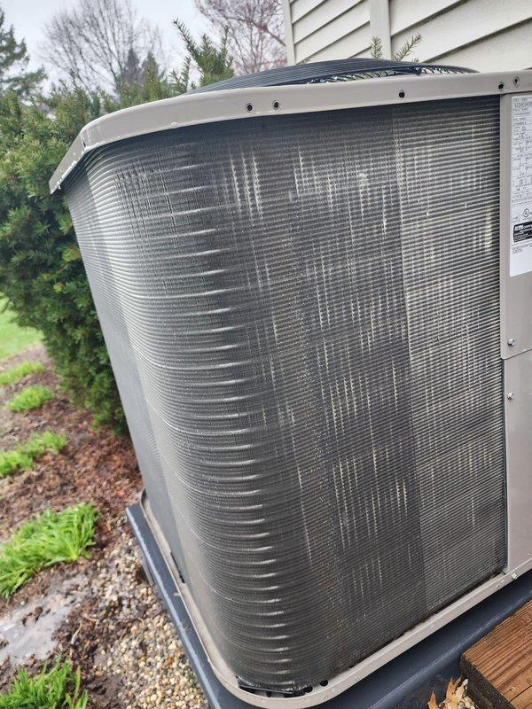 Completed scheduled cooling system maintenance and tune-up on residential HVAC unit. System operational and performing within normal parameters. Inspected outdoor condensing unit, verified compressor operation, examined refrigerant lines and electrical connections, and documented equipment condition with photographs.