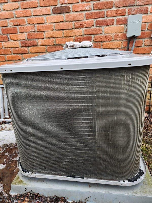 Completed routine preventative maintenance on residential heat pump system. Inspected outdoor condenser unit, noting significant accumulation of dirt and debris on coil surfaces requiring cleaning for optimal heat transfer efficiency. Examined compressor assembly, refrigerant lines, and electrical connections within unit, confirming all components operational with no visible refrigerant leaks or damaged wiring. System operating within normal parameters upon completion of scheduled maintenance visit.