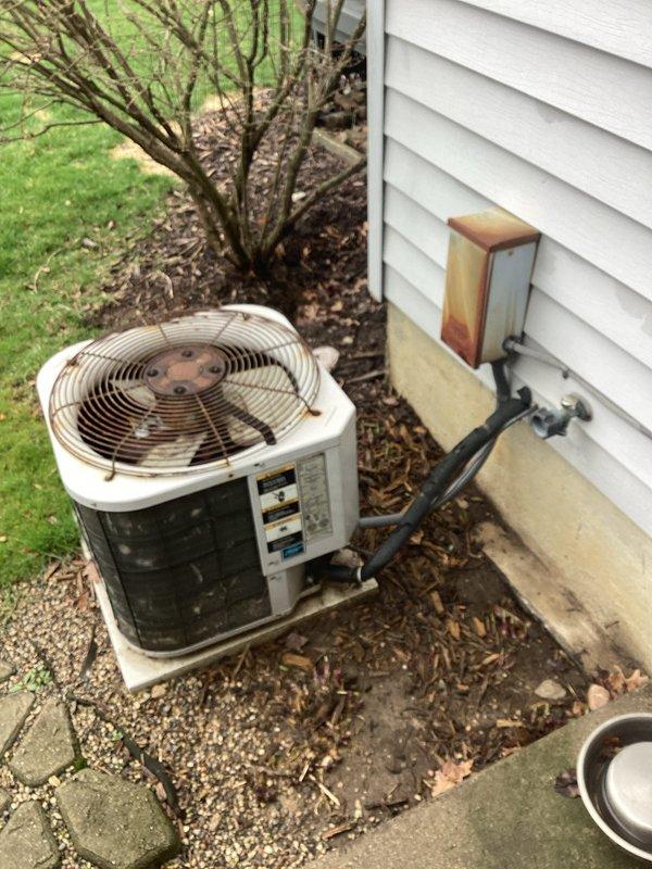 Provided comprehensive estimate for complete HVAC system replacement including outdoor air conditioning condensing unit and indoor natural gas furnace, both exceeding 20 years of service life and currently operational. Assessed existing equipment configuration with condensing unit located on exterior concrete pad with refrigerant lines running to basement-mounted furnace, evaluated ductwork connections and utility area layout to determine proper sizing and installation requirements for new high-efficiency replacement system.