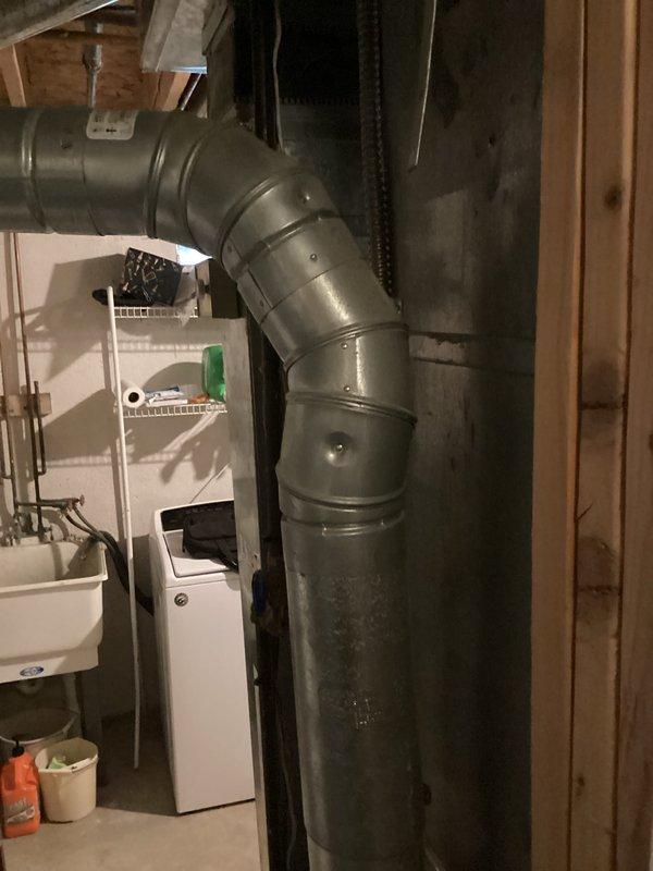 Provided comprehensive estimate for complete HVAC system replacement including outdoor air conditioning condensing unit and indoor natural gas furnace, both exceeding 20 years of service life and currently operational. Assessed existing equipment configuration with condensing unit located on exterior concrete pad with refrigerant lines running to basement-mounted furnace, evaluated ductwork connections and utility area layout to determine proper sizing and installation requirements for new high-efficiency replacement system.