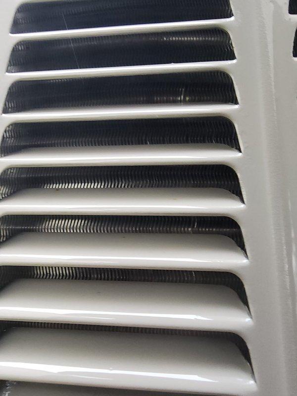 Completed routine cooling system maintenance and tune-up on properly functioning HVAC unit. Performed standard inspection of evaporator coil assembly, verified cleanliness of heat exchanger fins, and checked electrical connections and wiring. Inspected air distribution components including return air grille and louver assembly to ensure proper airflow. System confirmed operational with no deficiencies noted.