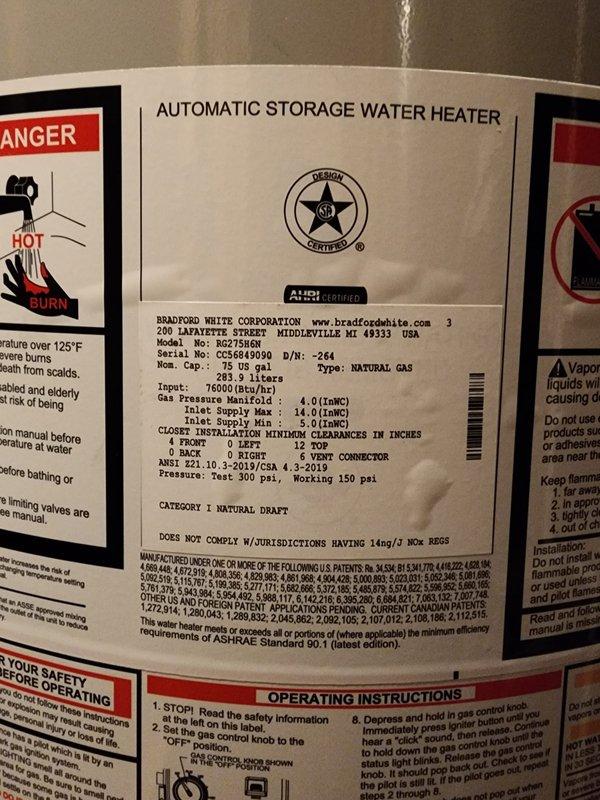 Successfully installed a new 75-gallon Bradford White natural gas water heater (model BG275R6N) in residential utility space. Installation included proper connection of copper supply lines, pressure relief valve, expansion tank mounting, and code-compliant venting with flexible metallic ductwork. All safety labels verified in place, gas connections tested for leaks, and unit confirmed operational upon completion.