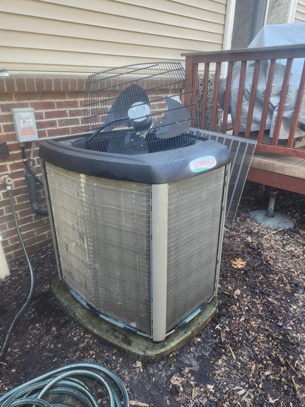 Completed annual preventative maintenance and tune-up on 7-year-old Lennox outdoor condensing unit located at rear of condominium. Performed comprehensive system inspection including cleaning condenser coils, checking refrigerant pressures, testing electrical components, verifying proper airflow through fan assembly, and inspecting refrigerant lines along exterior wall. Unit operating within normal parameters with no deficiencies noted; system ready for cooling season.