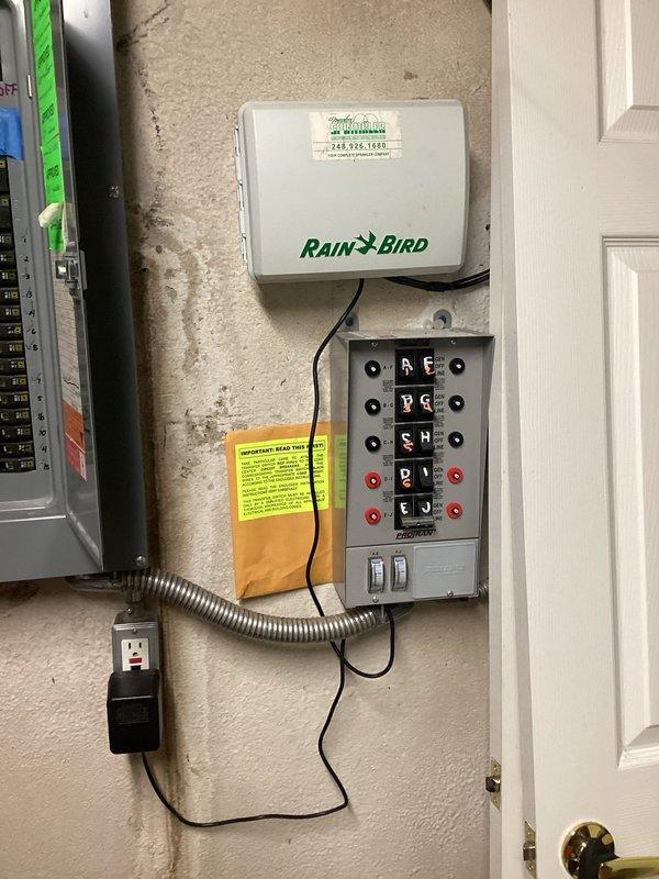 Conducted comprehensive site assessment and documentation for generator installation estimate at residential property. Evaluated existing electrical infrastructure including main breaker panel with 50-amp hot tub circuit, irrigation control system with Rain Bird controller, and associated electrical distribution equipment to determine integration requirements and load calculations for proposed standby generator system.