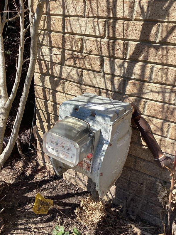 Conducted comprehensive site assessment for generator installation at residential property. Evaluated existing electrical infrastructure, including main distribution panel with dual columns of circuit breakers and exterior utility meter connection point. Documented current electrical system configuration to determine integration requirements for standby generator system. Assessed panel capacity, available breaker positions, and meter base accessibility for transfer switch installation. Photographed existing conditions of interior electrical panel and exterior utility meter mounting location to prepare detailed material and labor estimate for automatic transfer switch and generator hookup.