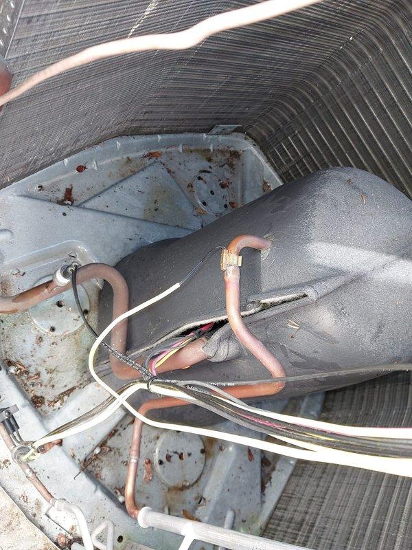 Completed scheduled cooling season maintenance on residential air conditioning system. Performed comprehensive inspection of outdoor condenser unit, including examination of coil fins, refrigerant lines, electrical connections, and overall component condition. Unit showed normal wear consistent with outdoor exposure, with weathering visible on cabinet panels and minor surface oxidation on copper refrigerant lines. Condenser coil fins displayed environmental debris accumulation, which was addressed during standard maintenance procedures. All system components were evaluated and found to be operating within normal parameters under the Worry Free Service Agreement coverage.